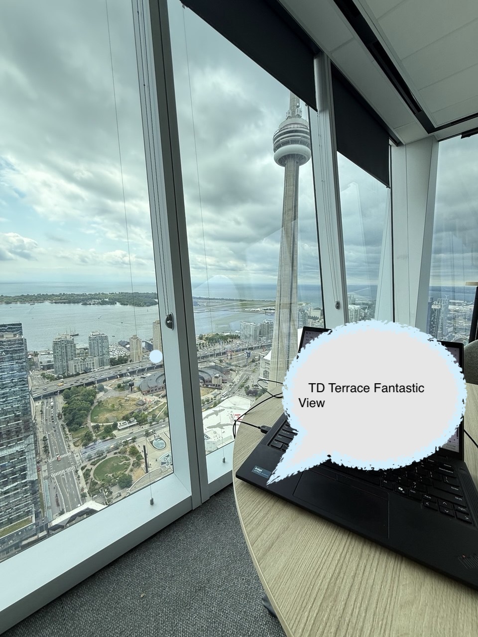 Focused work — view of the CN Tower from a downtown Toronto office